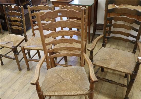 A set of five ash ladderback, rush seated dining chairs